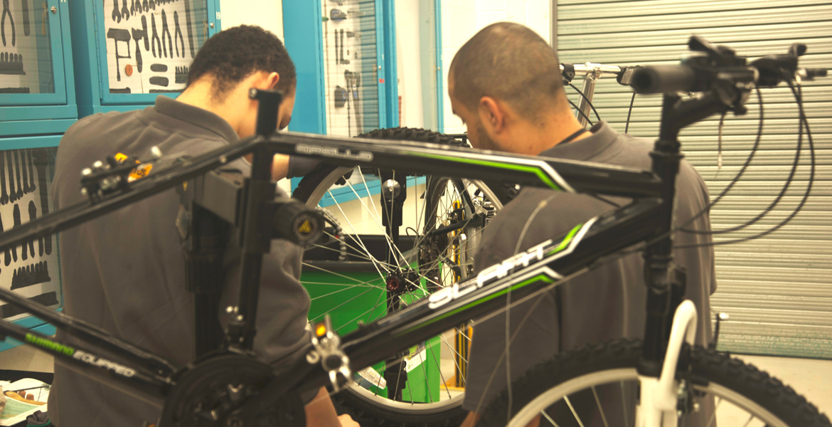 Academy repairing bicycle